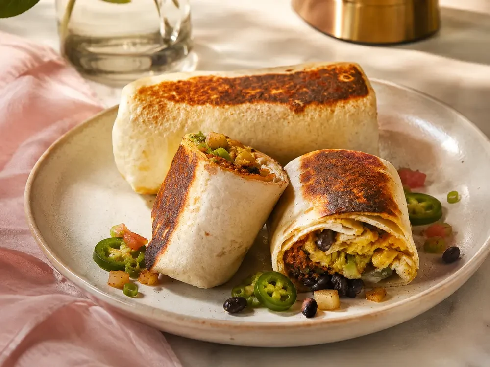 Crave grilled breakfast burrito with eggs, potatoes, black beans, peppers and avocado